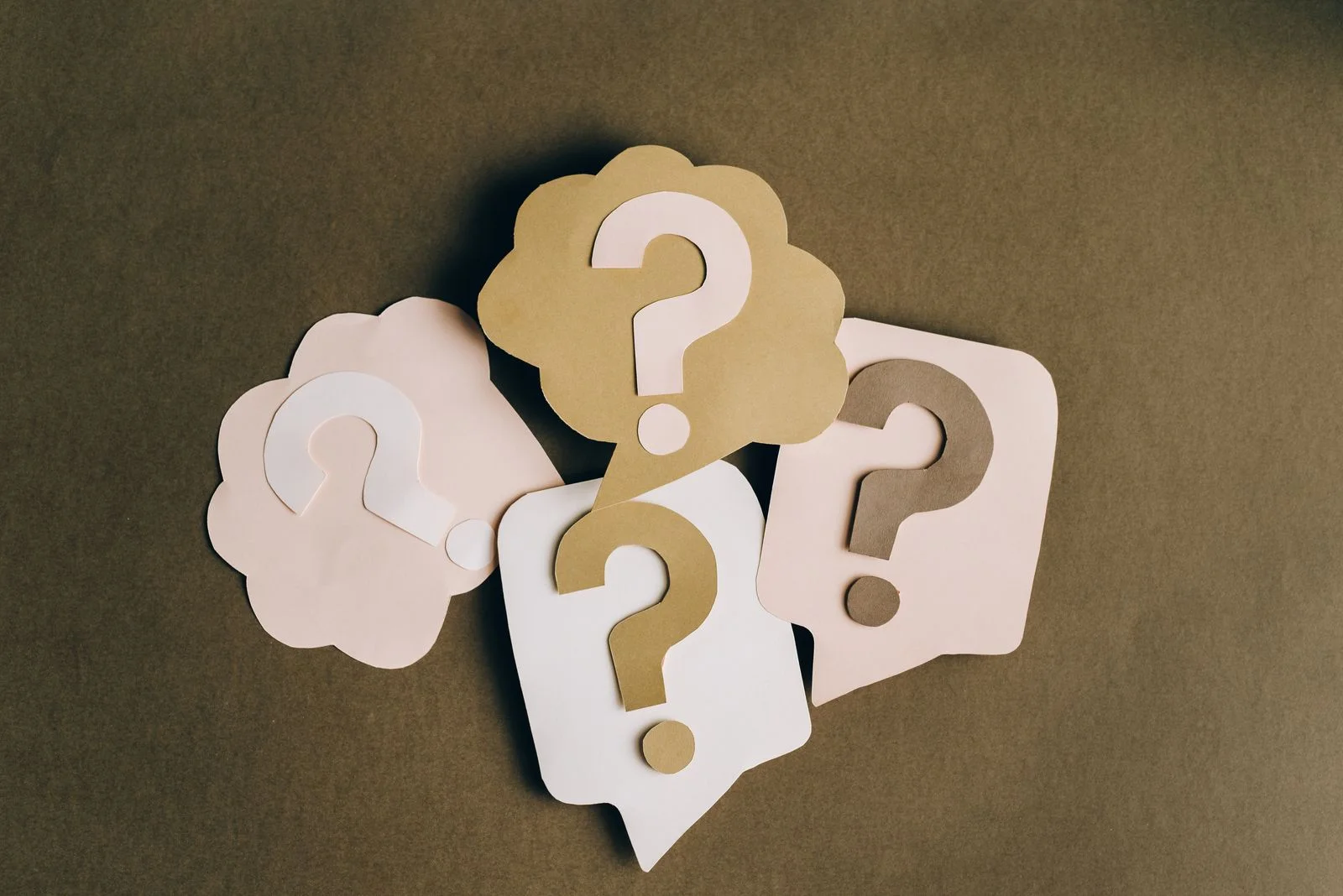 Question marks symbolizing frequently asked questions about towing services