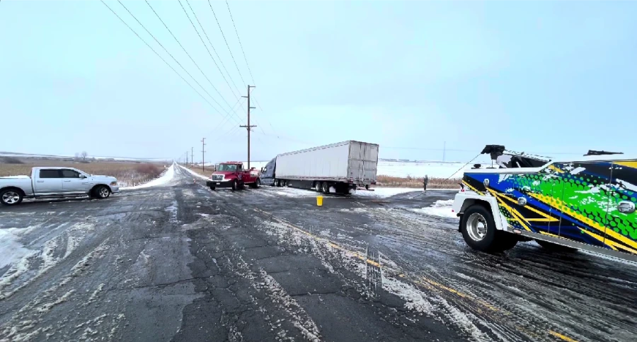 Tow truck responding to a winter breakdown on an icy road near Moses Lake, WA