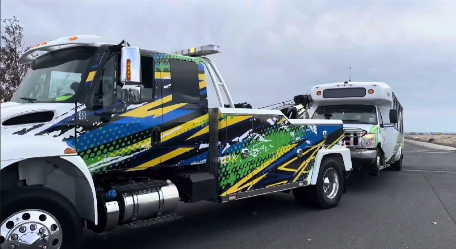 Heavy-duty tow truck towing a large vehicle in Moses Lake, WA